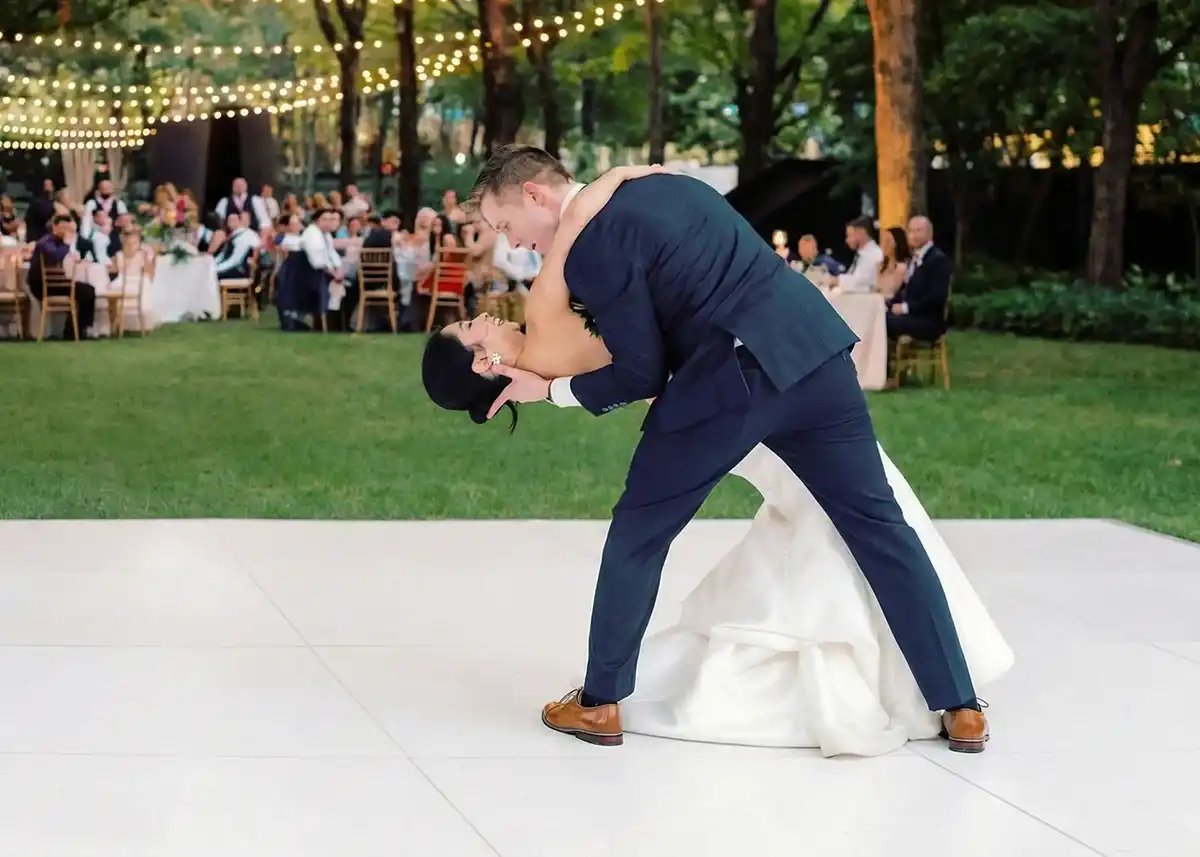 All white dance floor set up at an outdoor garden wedding reception near San Francisco